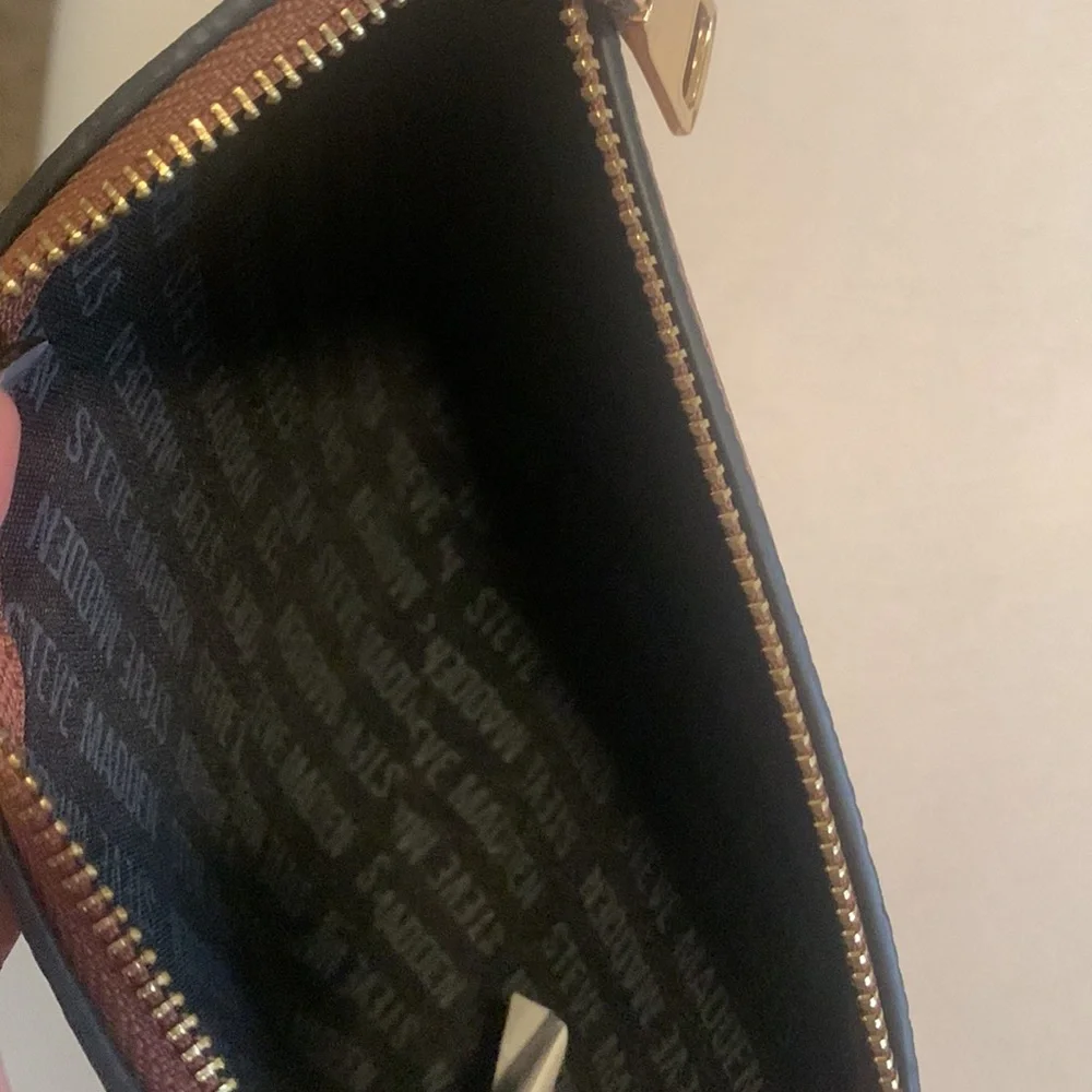 Brown Steve Madden wristlet with handle gold logo